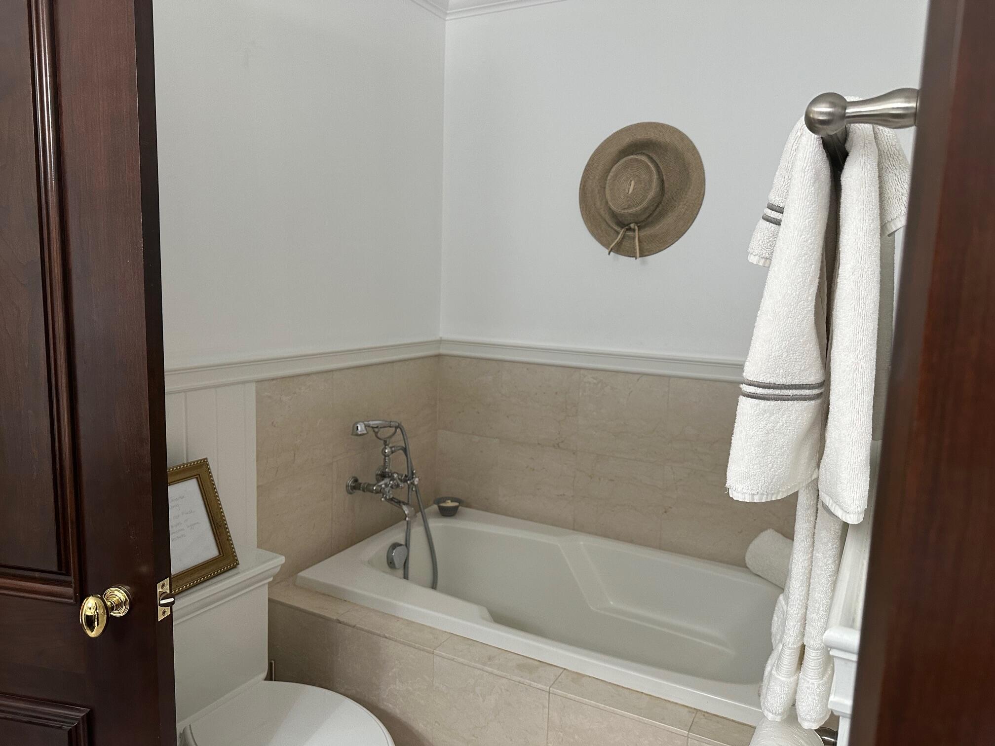 3375 Foothill Road, Unit 1114 Carpinteria, CA 93013 - Photo 11 of 17 a bathroom with a toilet and a bath tub