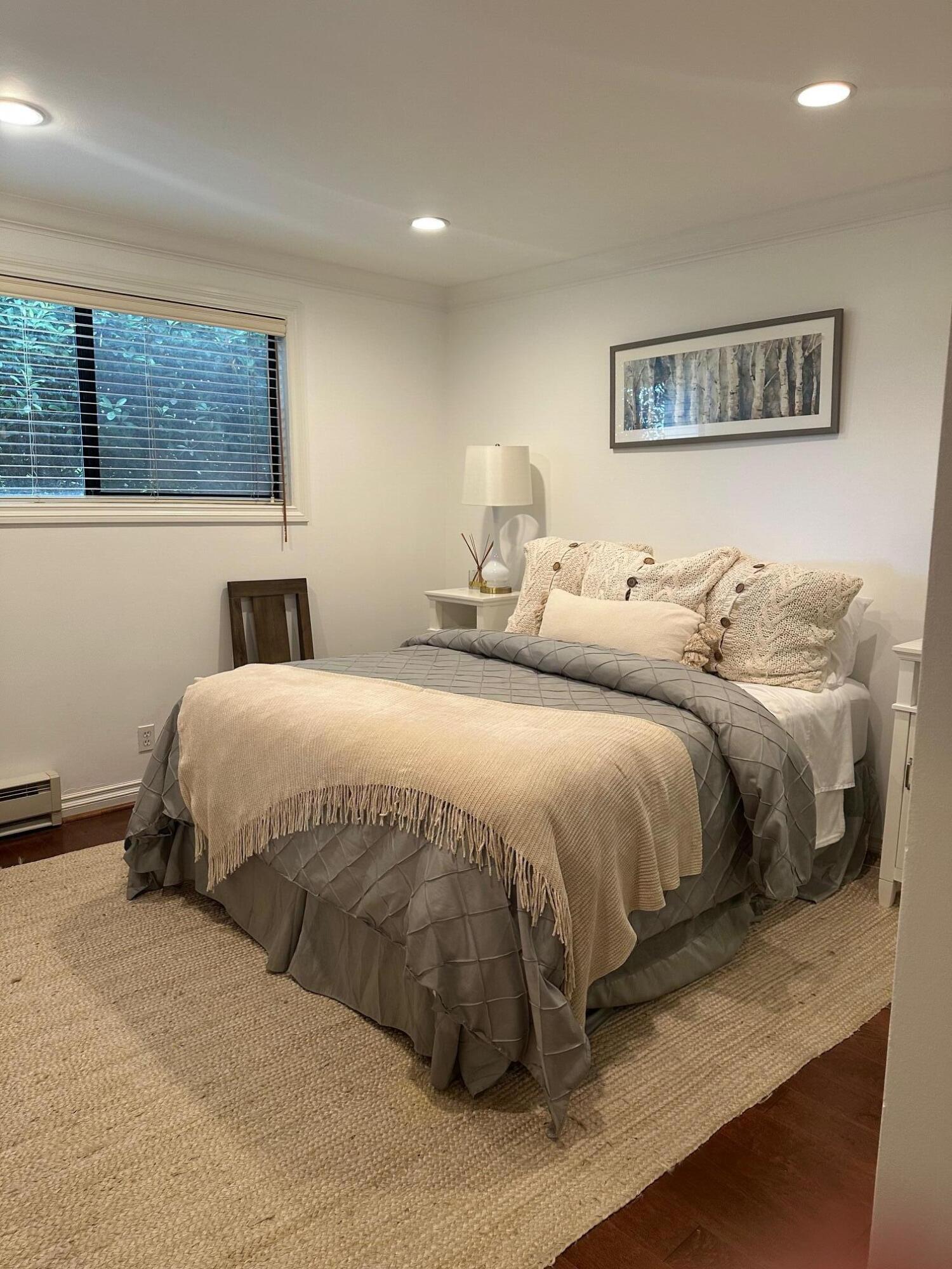 3375 Foothill Road, Unit 1114 Carpinteria, CA 93013 - Photo 13 of 17 a bedroom with a bed and glass windows