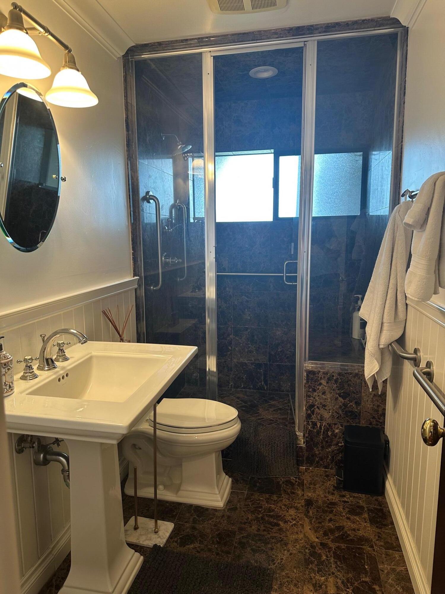 3375 Foothill Road, Unit 1114 Carpinteria, CA 93013 - Photo 14 of 17 a bathroom with a sink toilet and shower