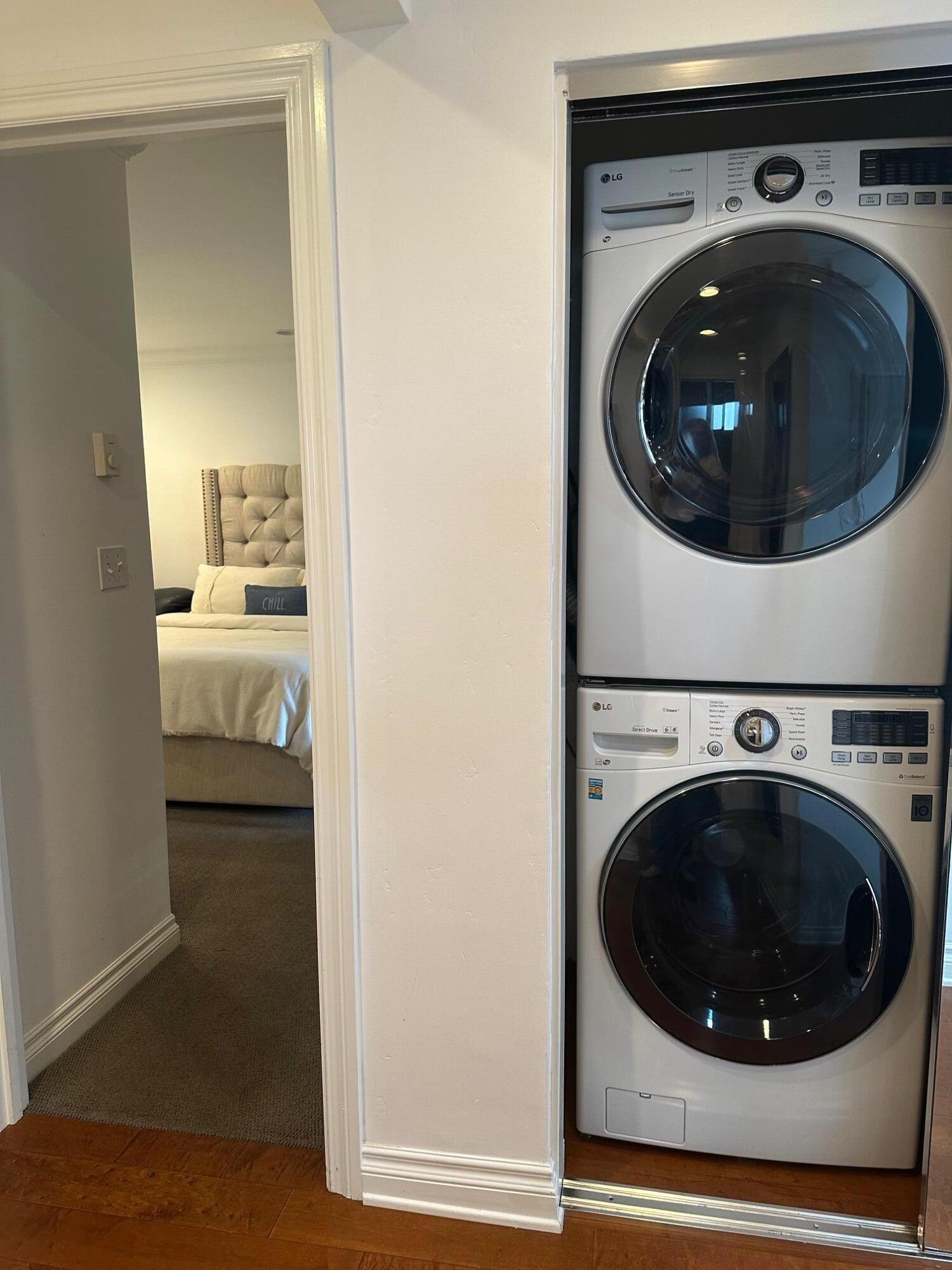 3375 Foothill Road, Unit 1114 Carpinteria, CA 93013 - Photo 15 of 17 a utility room with wooden floor washer and dryer