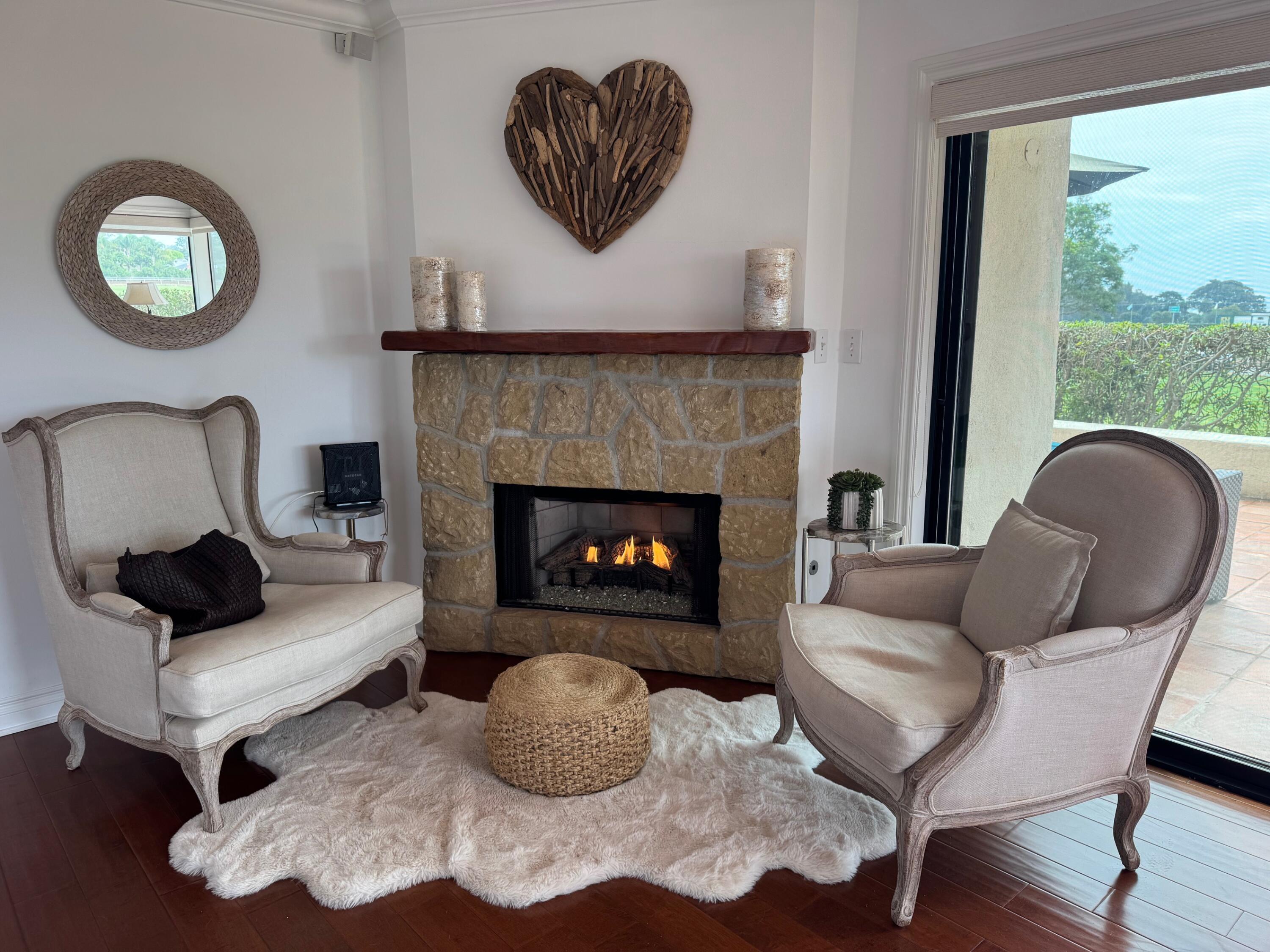 3375 Foothill Road, Unit 1114 Carpinteria, CA 93013 - Photo 3 of 17 a living room with furniture and a fireplace