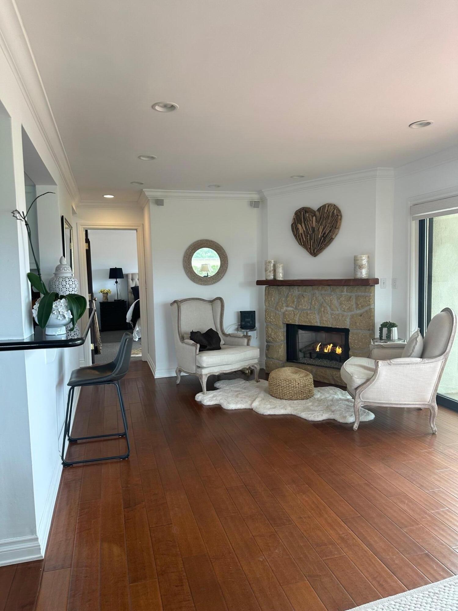 3375 Foothill Road, Unit 1114 Carpinteria, CA 93013 - Photo 4 of 17 a living room with furniture and a fireplace