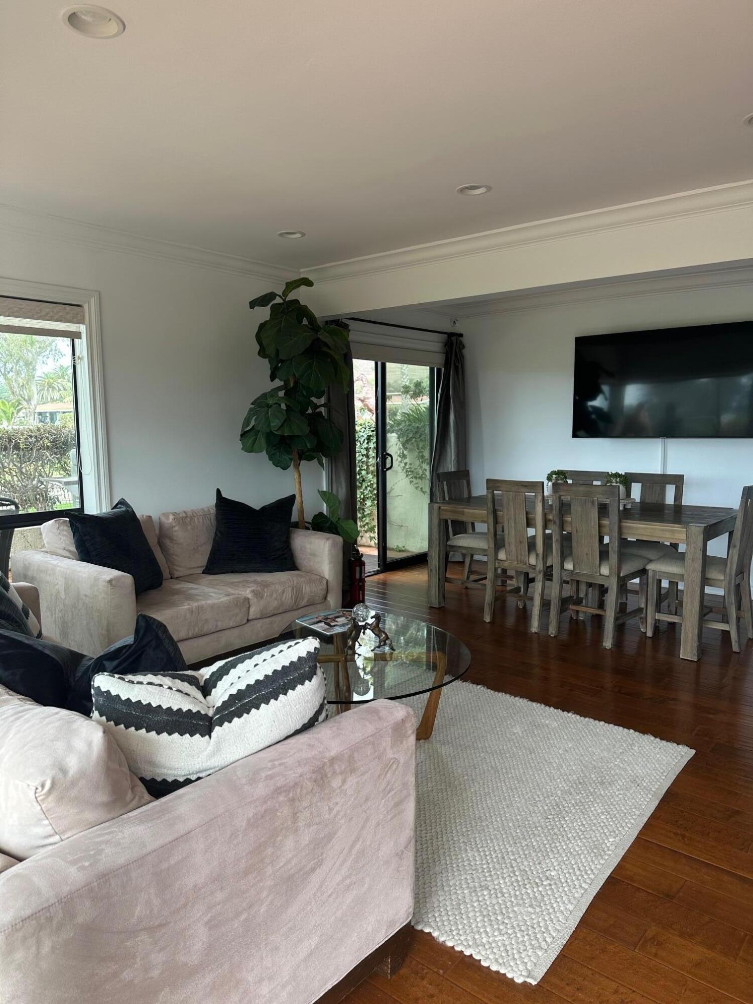 3375 Foothill Road, Unit 1114 Carpinteria, CA 93013 - Photo 5 of 17 a living room with furniture and a flat screen tv