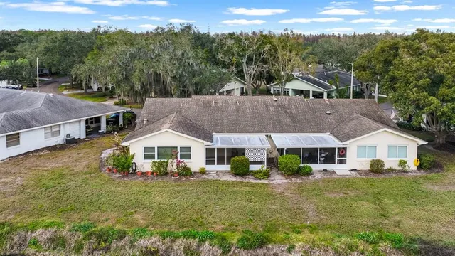 an aerial view of residential houses with outdoor space