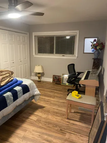 a front view of a house with a garden and patio