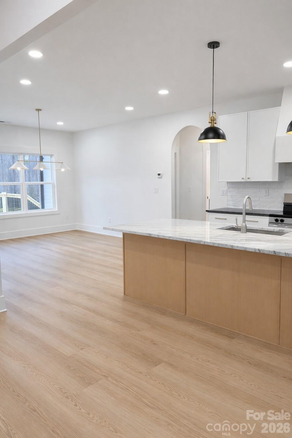 5135 Star Magnolia Court Clover, SC 29710 - Photo 20 of 39 a kitchen with kitchen island a counter top space a sink and appliances