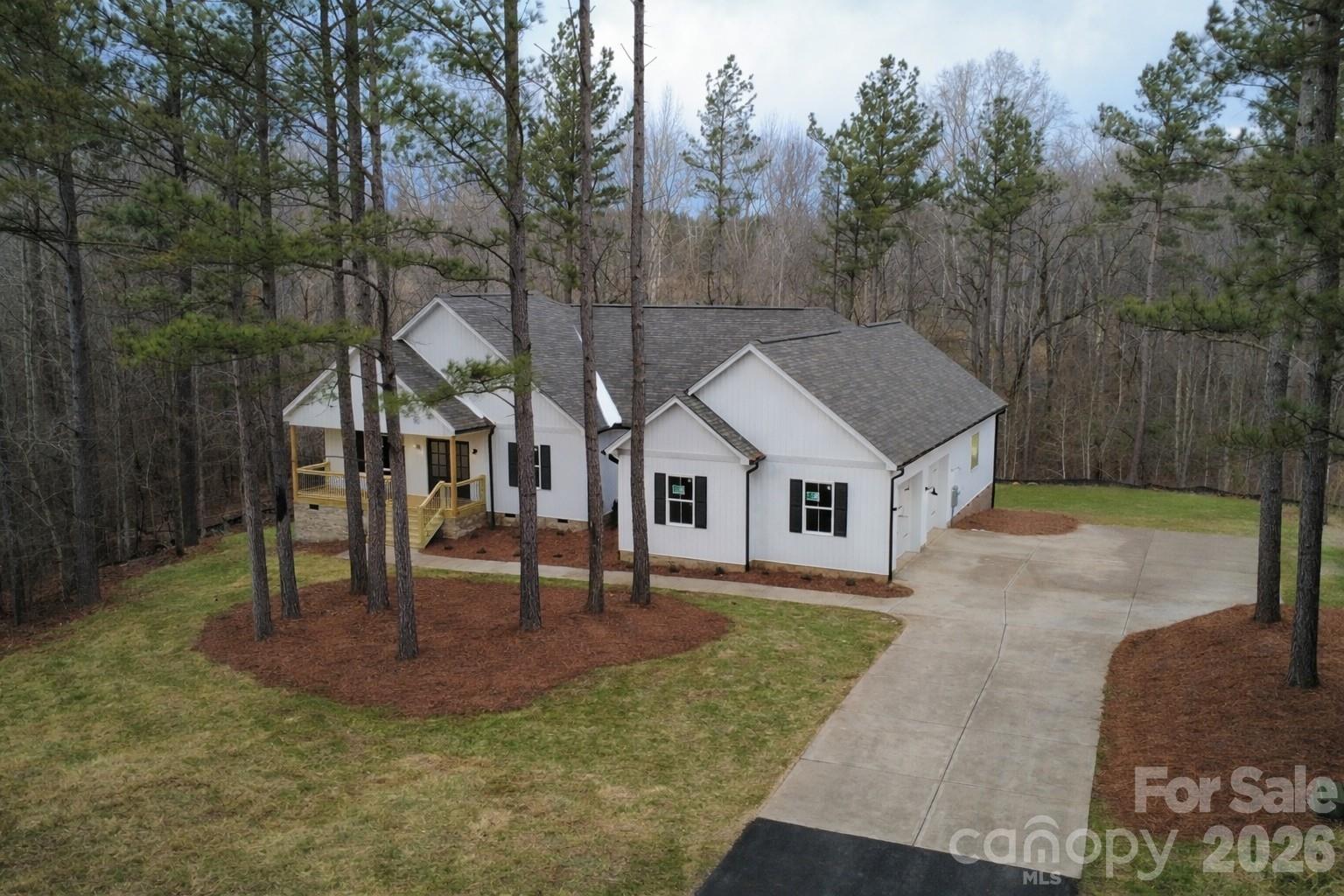 5135 Star Magnolia Court Clover, SC 29710 - Photo 2 of 39 a front view of a house with a yard fountain