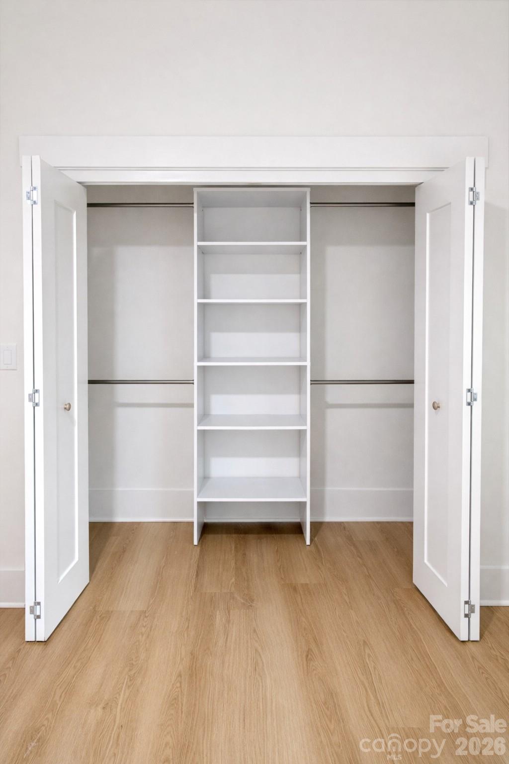 5135 Star Magnolia Court Clover, SC 29710 - Photo 34 of 39 a view of walk in closet with empty racks