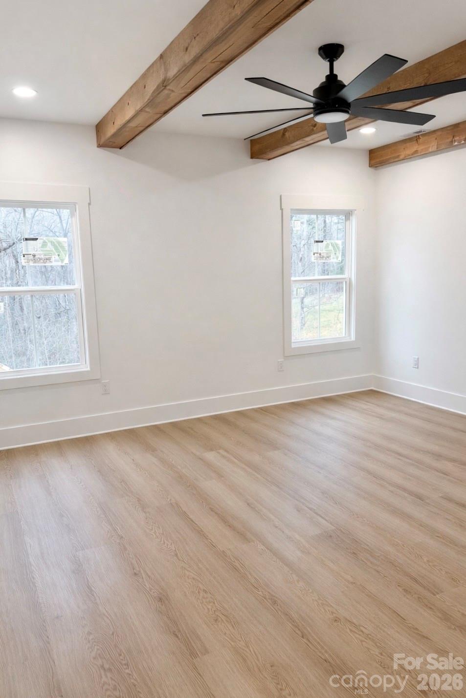 5135 Star Magnolia Court Clover, SC 29710 - Photo 9 of 39 a view of an empty room with a window and wooden floor