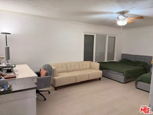 a living room with furniture and a lamp