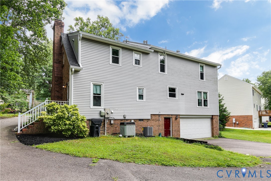 3924 Belspring Road Chester, VA 23831 - Photo 2 of 36 Vinyl-sided exterior featuring a brick chimney and