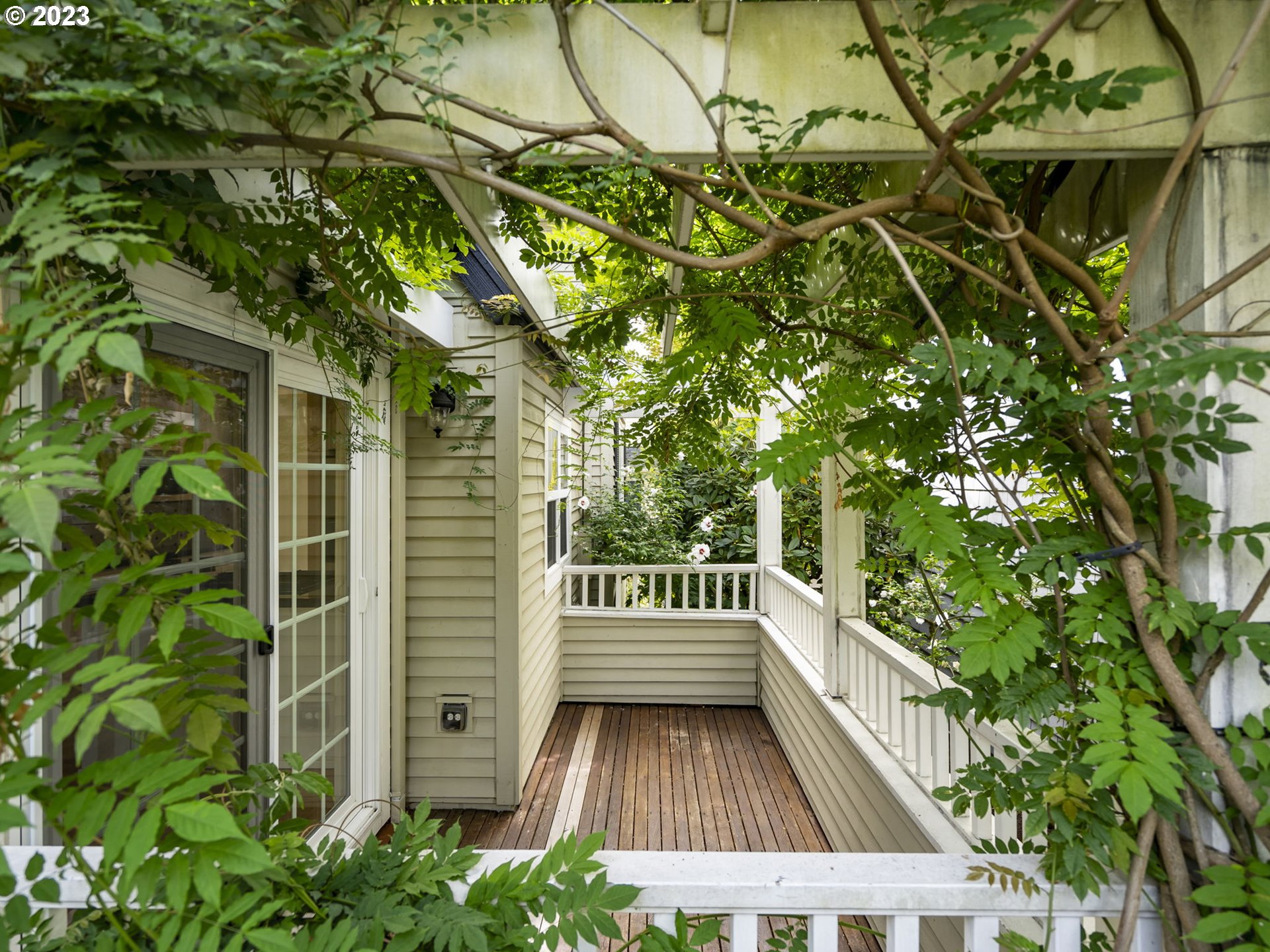 2265 Northwest Miller Road Portland, OR 97229 - Photo 14 of 31 a view of balcony with wooden floor and fence
