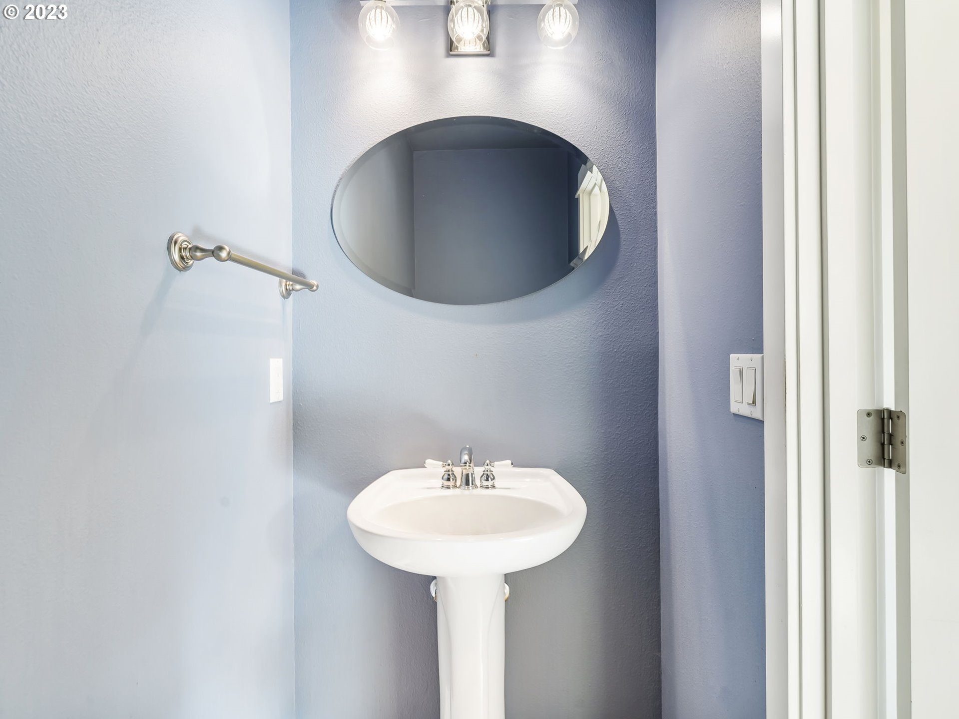 2265 Northwest Miller Road Portland, OR 97229 - Photo 17 of 31 a bathroom with a sink and a mirror