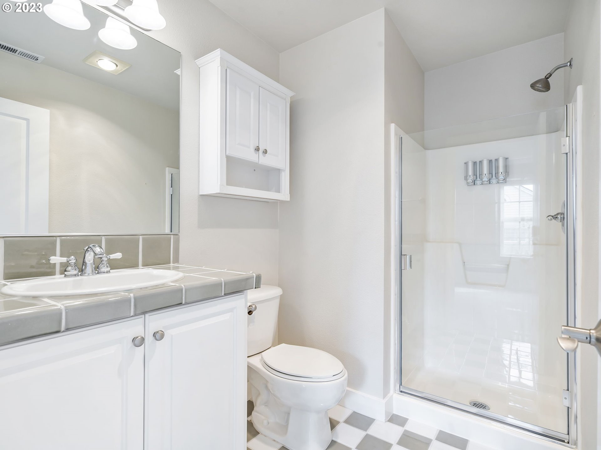 2265 Northwest Miller Road Portland, OR 97229 - Photo 20 of 31 a bathroom with a sink toilet and shower