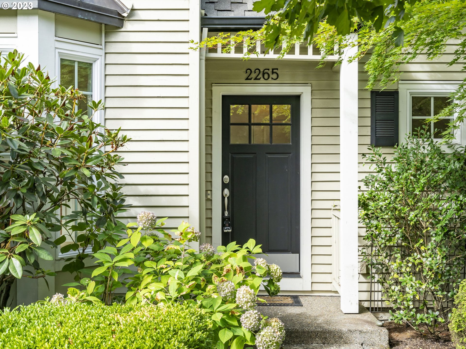2265 Northwest Miller Road Portland, OR 97229 - Photo 2 of 31 a front view of a house with a yard