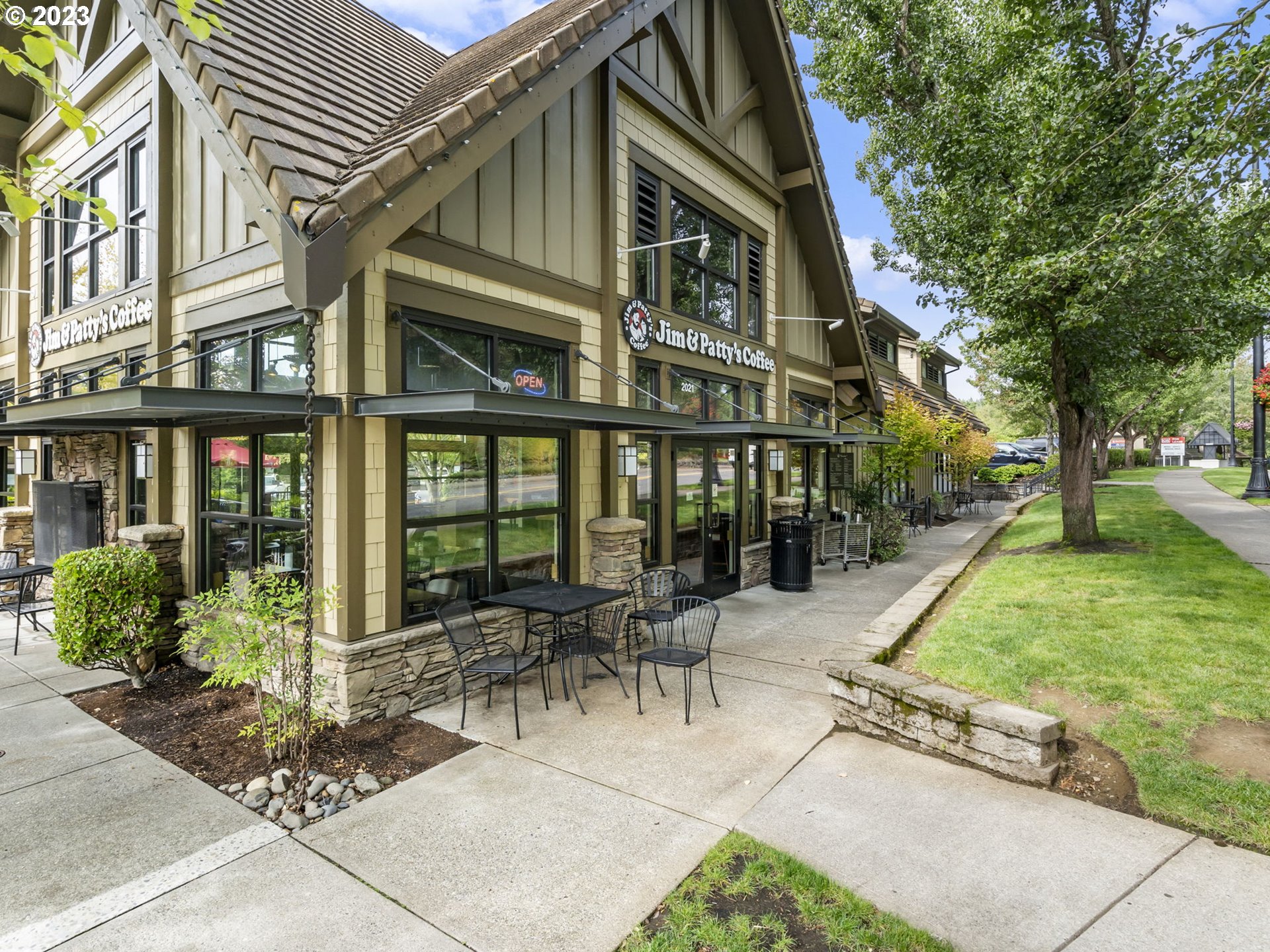2265 Northwest Miller Road Portland, OR 97229 - Photo 30 of 31 a view of a building with a garden and bench