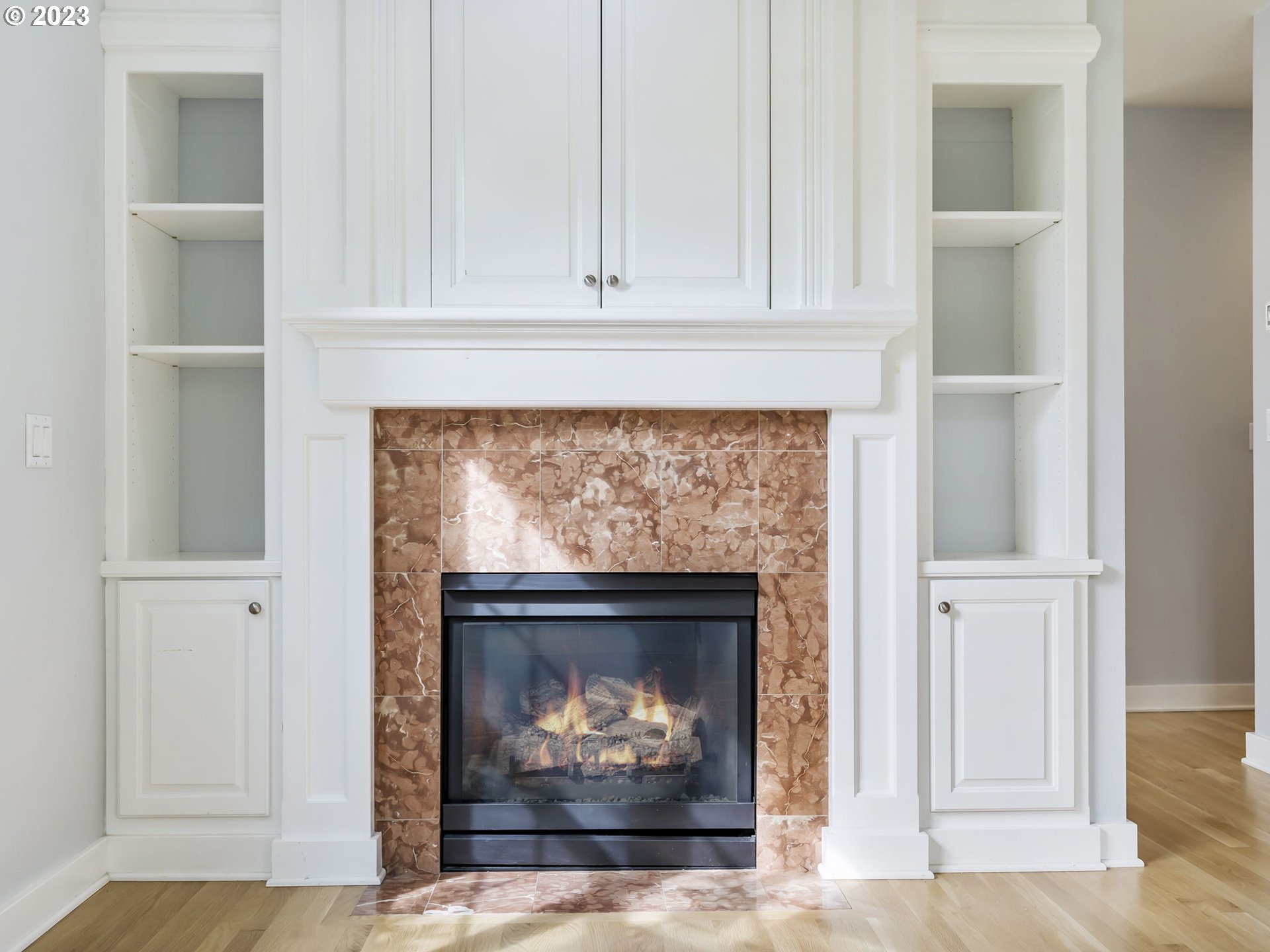 2265 Northwest Miller Road Portland, OR 97229 - Photo 7 of 31 a living room with a fireplace