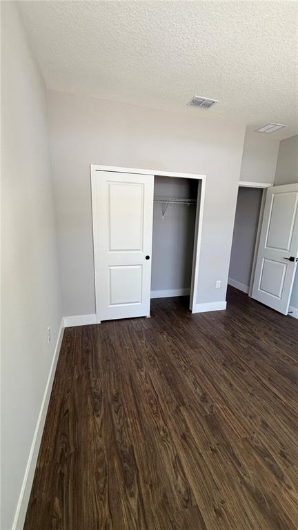 76 Boston Lane Palm Coast, FL 32137 - Photo 14 of 15 an empty room with wooden floor and closet