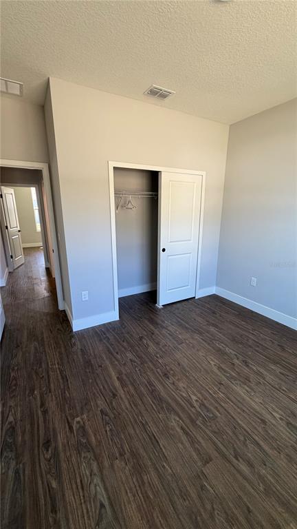 76 Boston Lane Palm Coast, FL 32137 - Photo 15 of 15 a view of an empty room with wooden floor and a ceiling fan