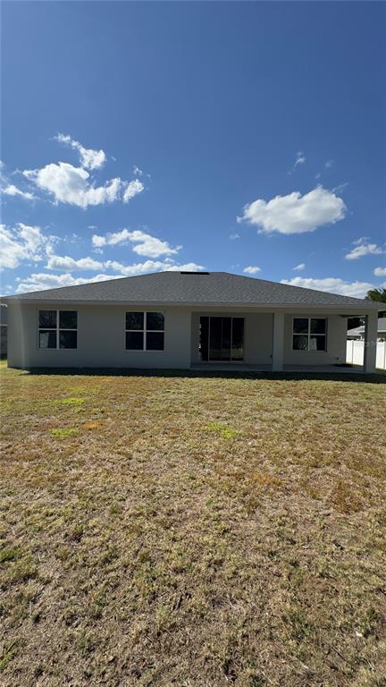 76 Boston Lane Palm Coast, FL 32137 - Photo 2 of 15 a front view of a house with a large space