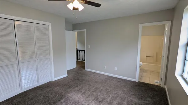 an empty room with closet area