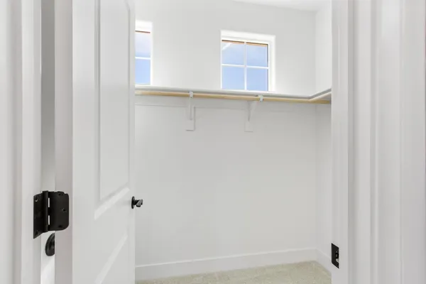 a bathroom with a window and shower