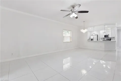 a spacious bedroom with a bed and furniture