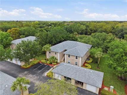 an aerial view of residential house with outdoor space and lake view
