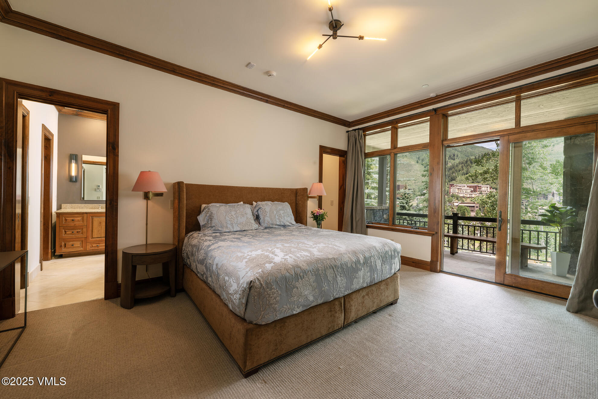 185 Forest Road Vail, CO 81657 - Photo 7 of 13 a bed sitting in a spacious bedroom next to a window