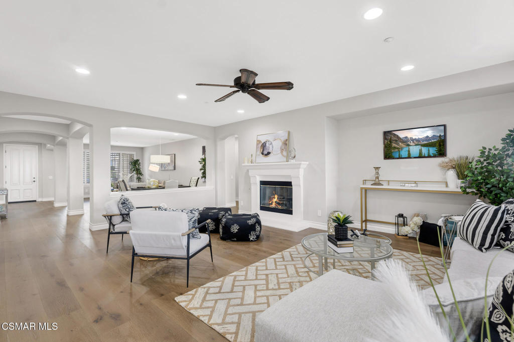 3421 Deep Waters Court Simi Valley, CA 93065 - Photo 21 of 74 a living room with furniture a fireplace and a flat screen tv