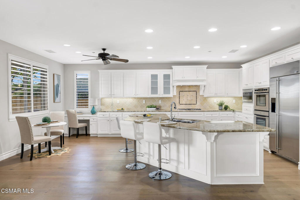 3421 Deep Waters Court Simi Valley, CA 93065 - Photo 25 of 74 a kitchen with stainless steel appliances granite countertop a stove and a refrigerator