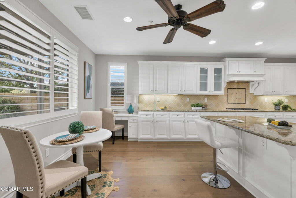 3421 Deep Waters Court Simi Valley, CA 93065 - Photo 33 of 74 a kitchen with granite countertop white cabinets and stainless steel appliances