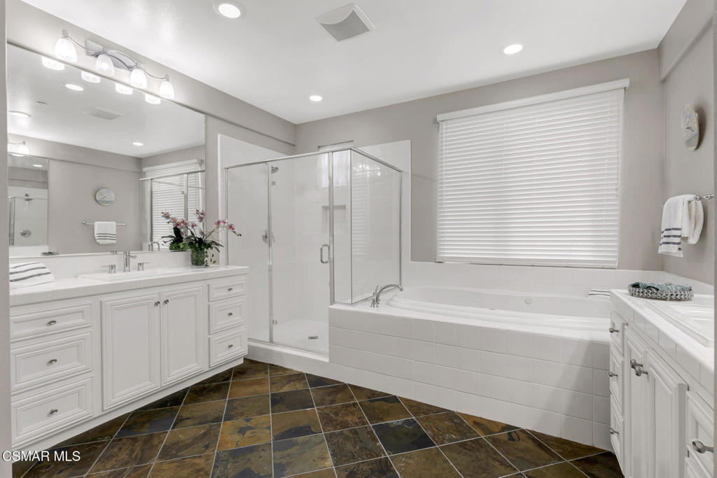 3421 Deep Waters Court Simi Valley, CA 93065 - Photo 41 of 74 a spacious bathroom with a double vanity sink a mirror and a bathtub