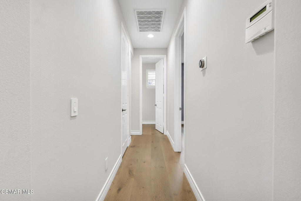 3421 Deep Waters Court Simi Valley, CA 93065 - Photo 45 of 74 a view of a hallway with wooden floor and staircase