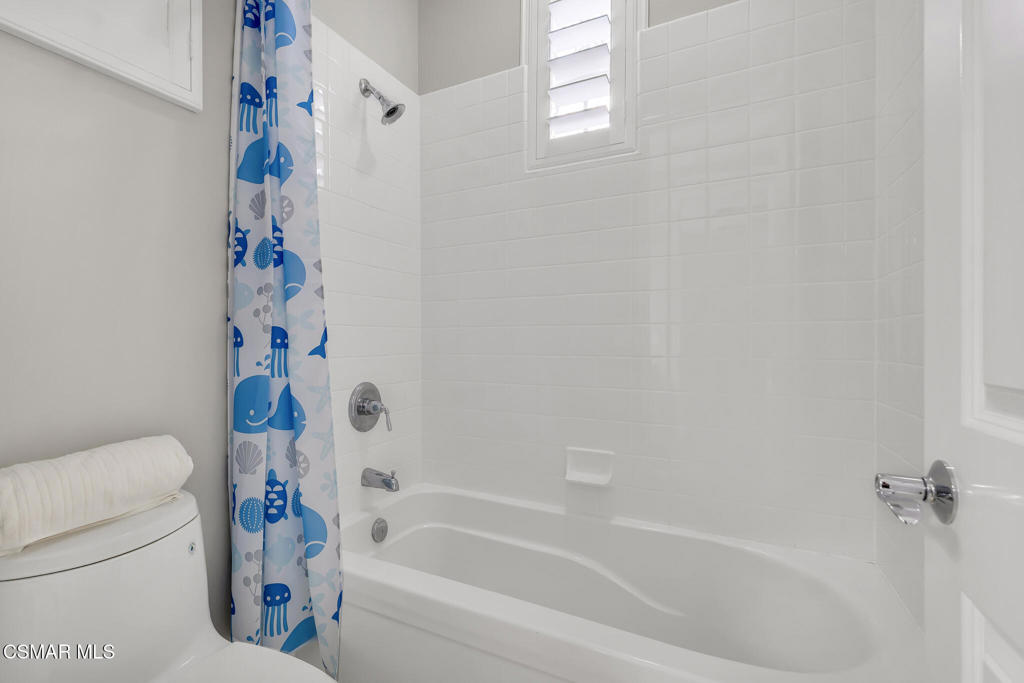 3421 Deep Waters Court Simi Valley, CA 93065 - Photo 53 of 74 a bathroom with a bathtub and a shower curtain