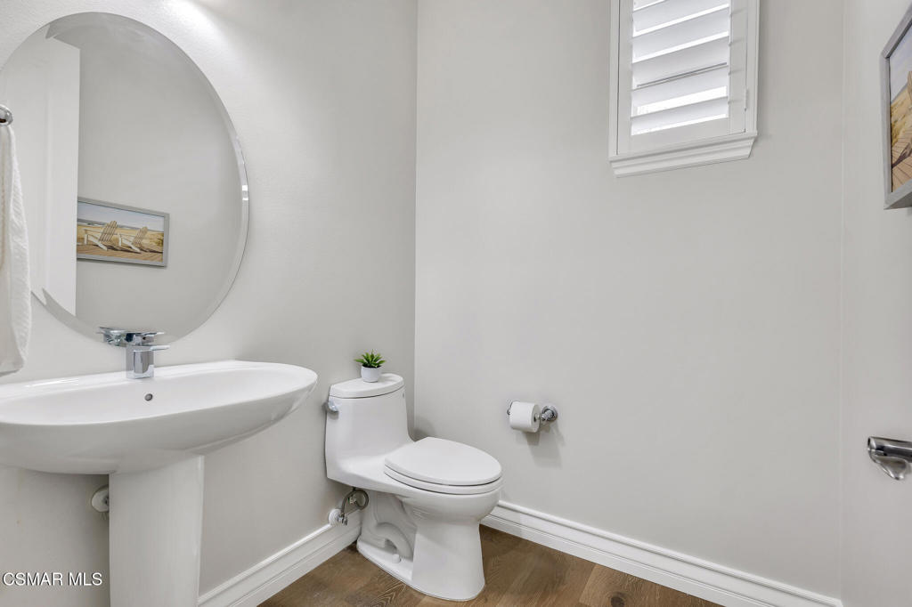 3421 Deep Waters Court Simi Valley, CA 93065 - Photo 56 of 74 a bathroom with a toilet sink and mirror