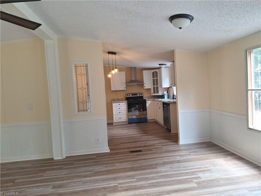 6195 Whites Chapel Road Staley, NC 27355 - Photo 5 of 20 Livingroom and kitchen