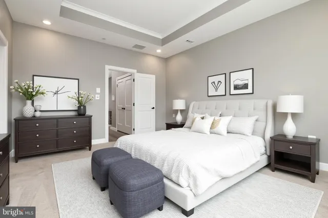 a bedroom with a bed and a closet