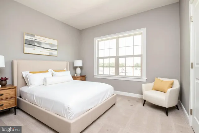 a bedroom with bed and a couch