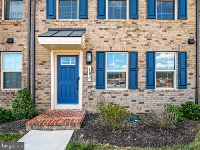 a view of a brick building with a entrance door