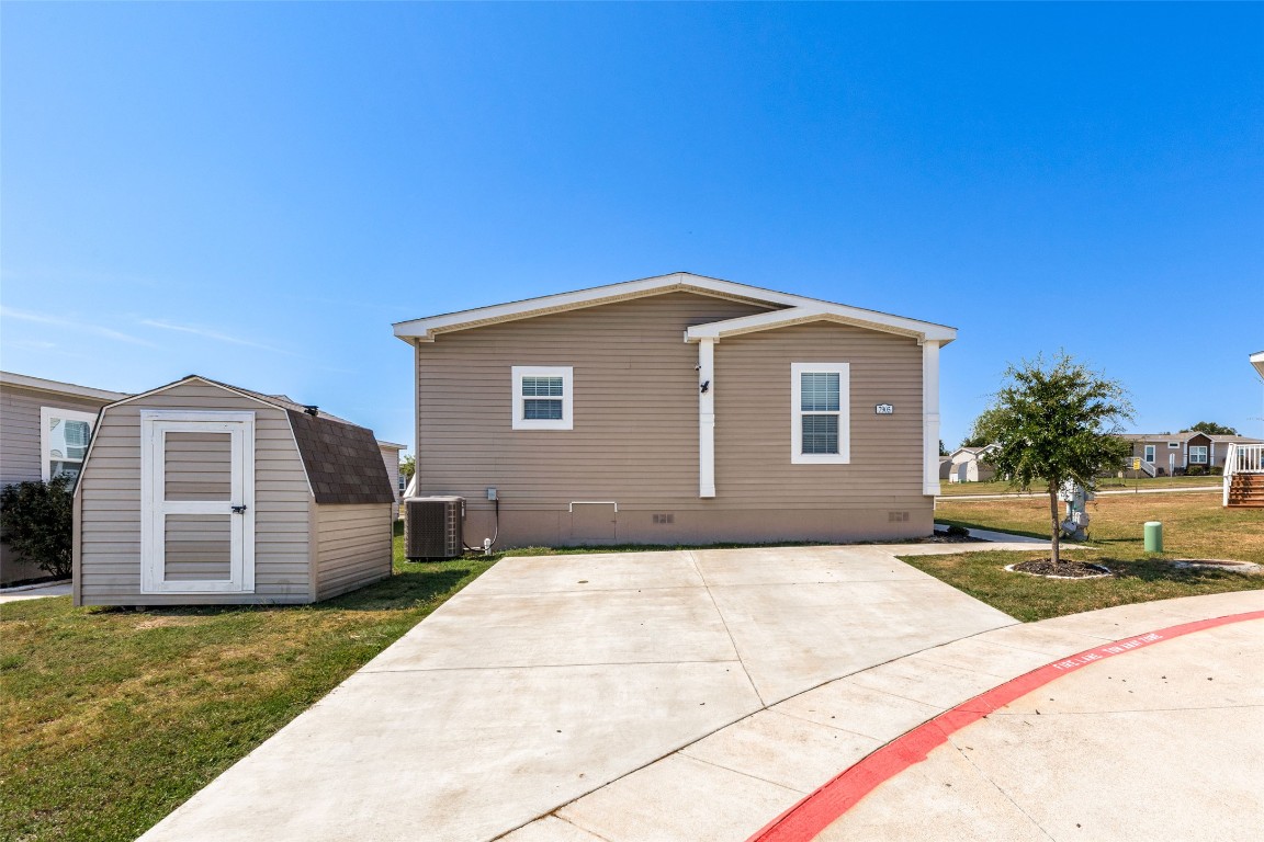 7905 Plato Path, Unit 111 Austin, TX 78724 - Photo 12 of 12 a front view of a house with a garden