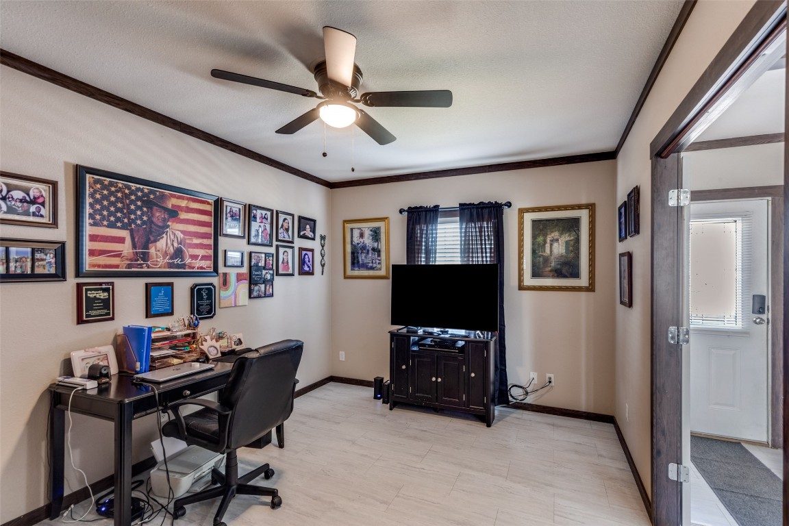 7905 Plato Path, Unit 111 Austin, TX 78724 - Photo 6 of 12 a workspace with furniture window and wooden floor