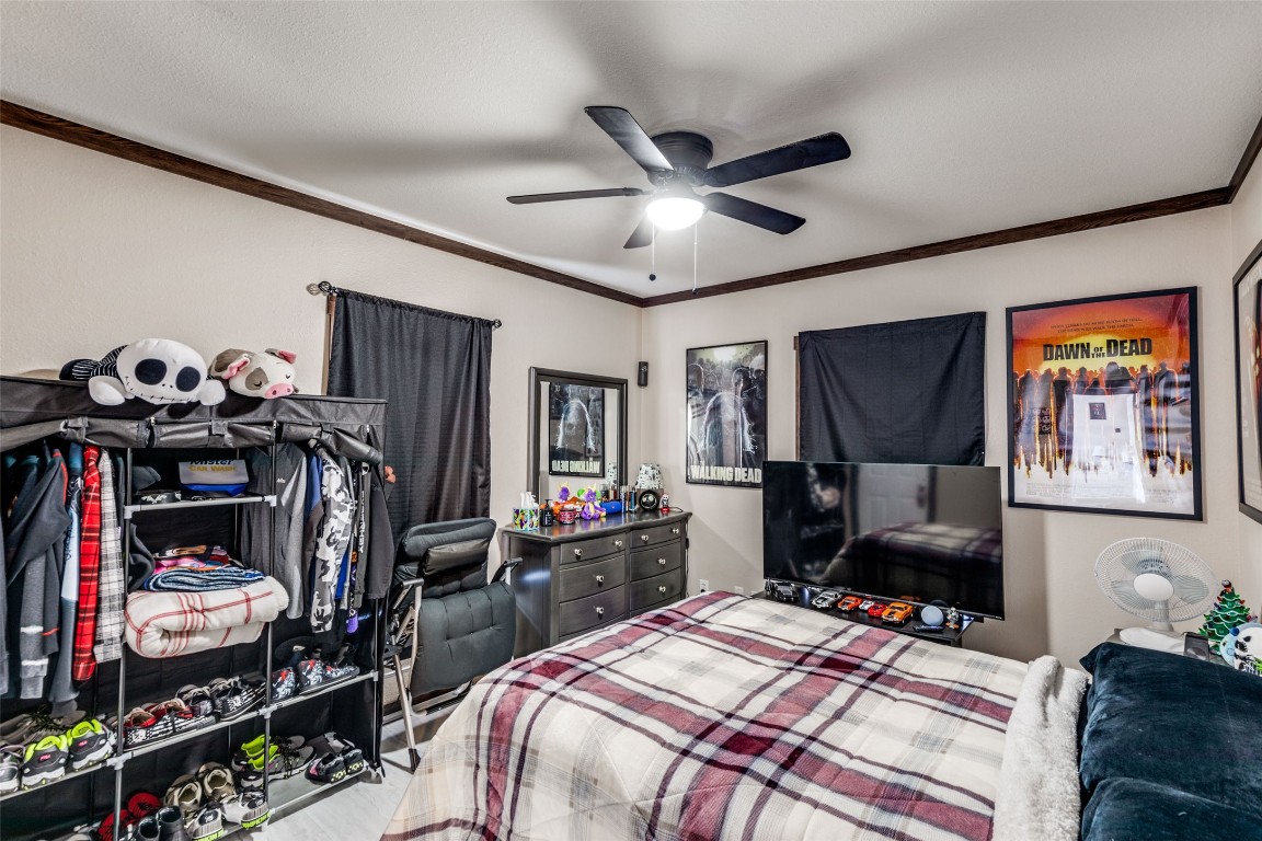 7905 Plato Path, Unit 111 Austin, TX 78724 - Photo 10 of 12 a bedroom that has a bed and a tv in it