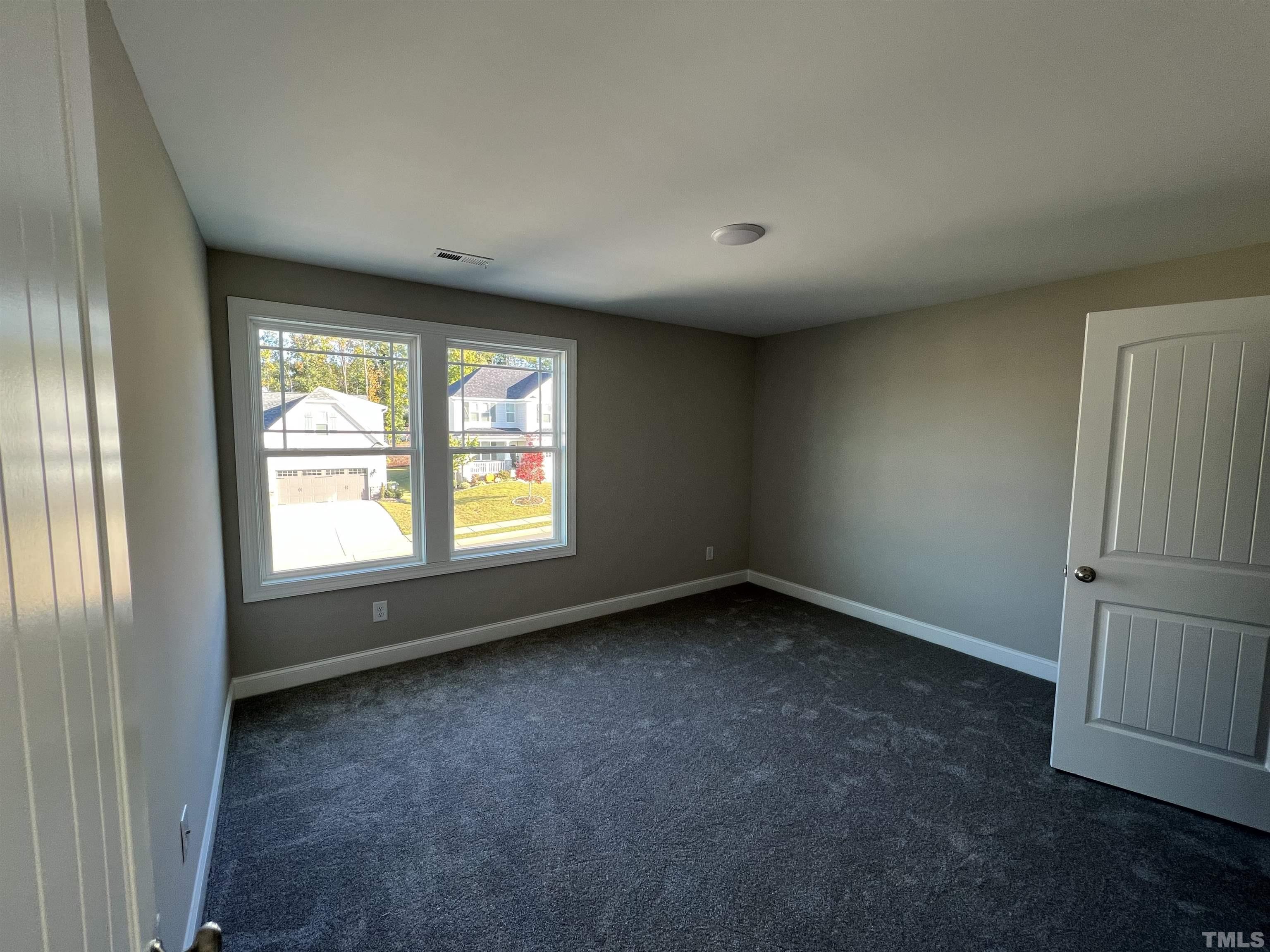 80 Unique Place Garner, NC 27529 - Photo 21 of 28 an empty room with a window