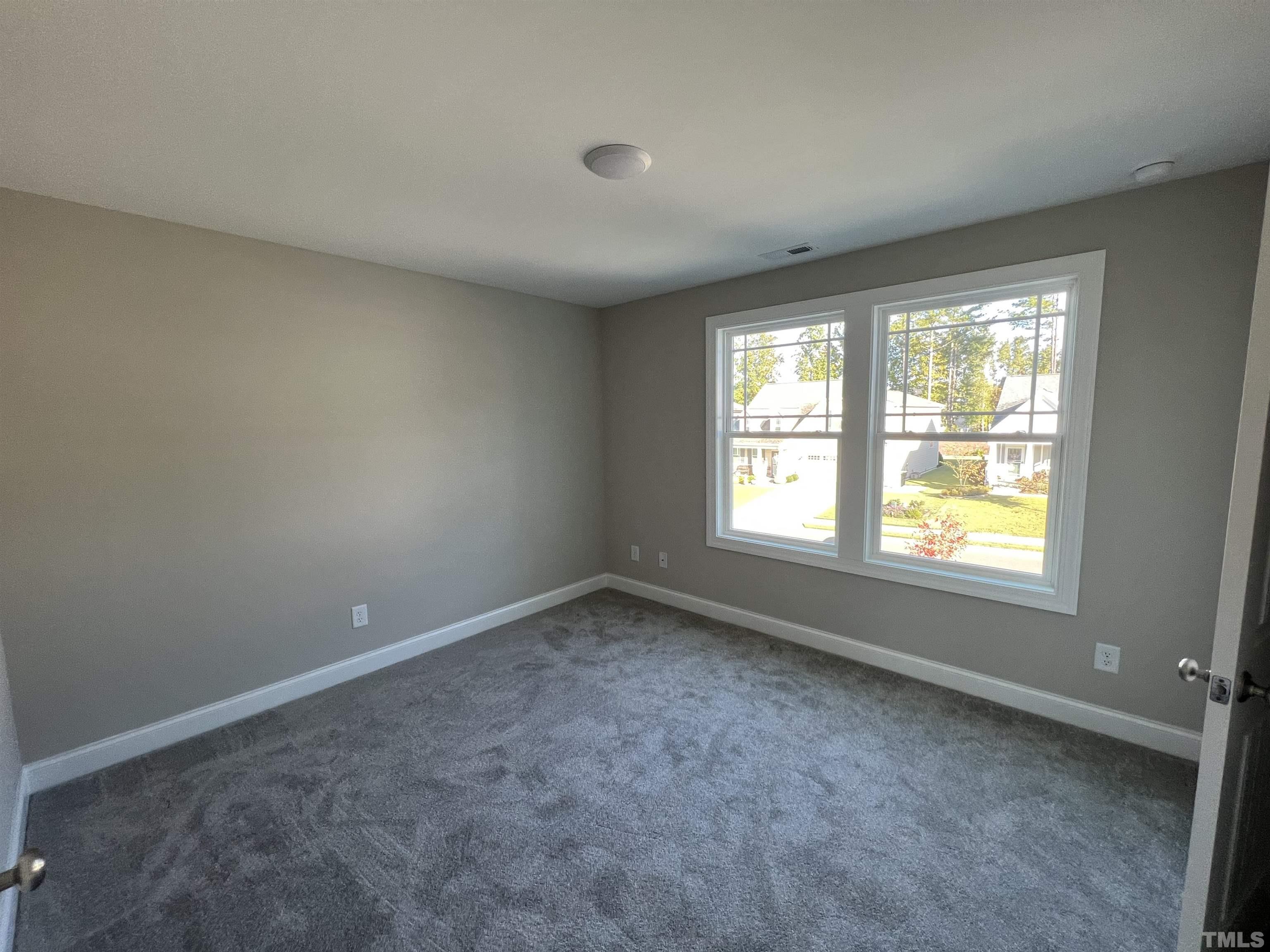80 Unique Place Garner, NC 27529 - Photo 25 of 28 an empty room with a window