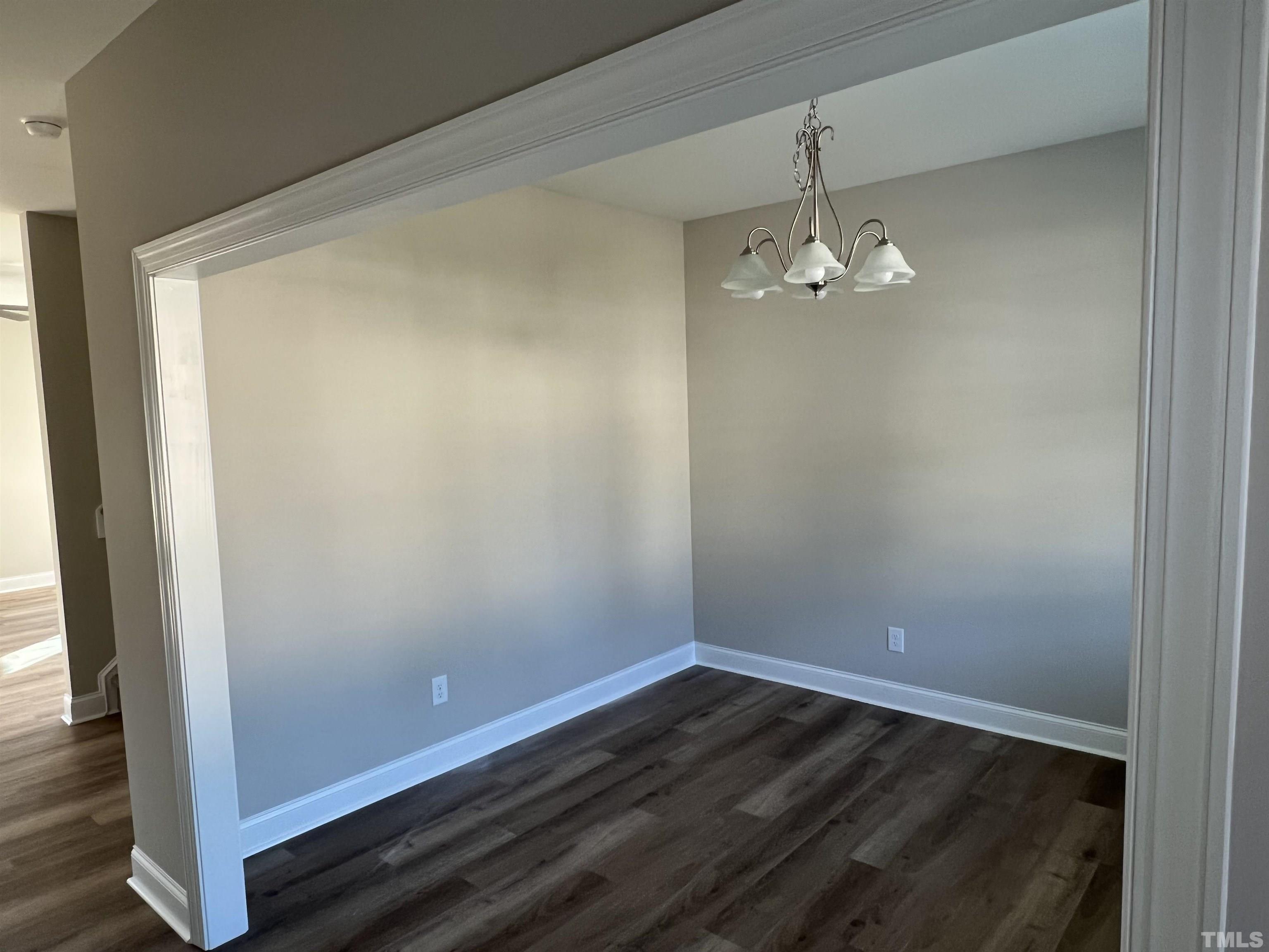 80 Unique Place Garner, NC 27529 - Photo 6 of 28 a view of a room with wooden floor and cabinetry