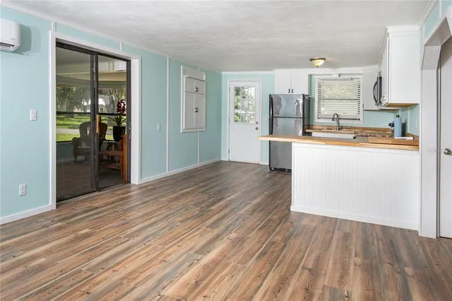 a view of kitchen with wooden floor