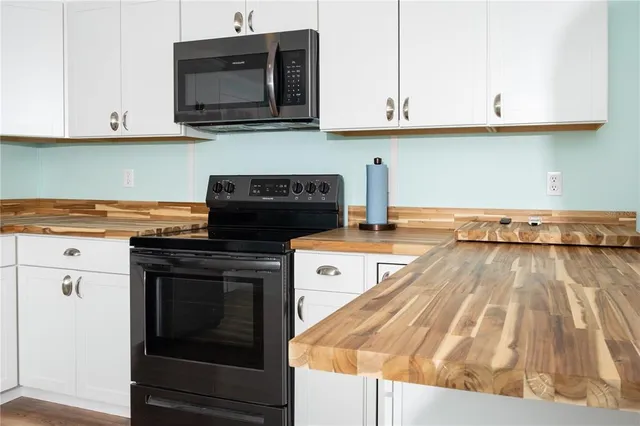 a kitchen with a stove and a microwave