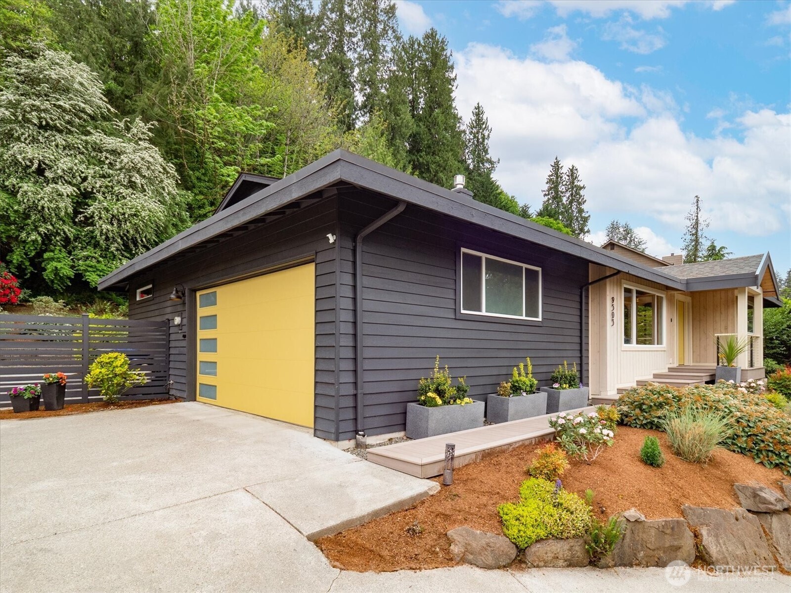 9503 Odin Way Bothell, WA 98011 - Photo 2 of 39 a front view of a house with a yard