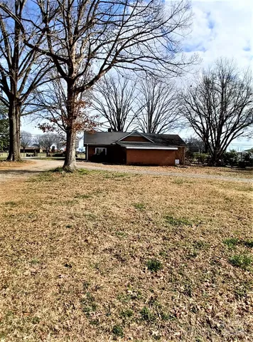 a view of open space with yard